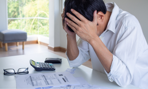 men looking at bills