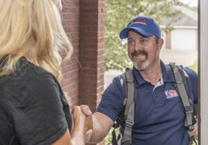 Dutch Enterprises service technician shaking hands with a homeowner